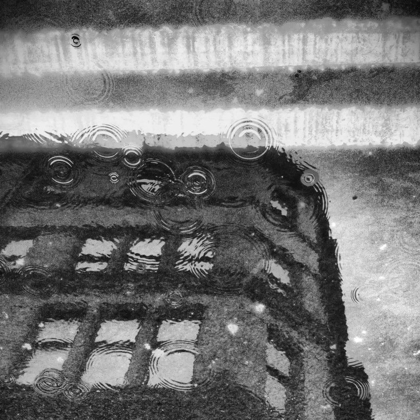 Reflection in a puddle while drizzling in Northern UK_edited